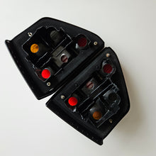 Load image into Gallery viewer, Hella Smoked Tail Light Set Golf Mk2
