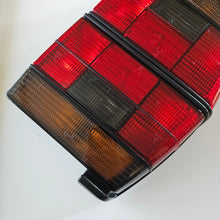 Load image into Gallery viewer, Hella Smoked Tail Light Set Jetta Mk2
