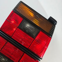 Load image into Gallery viewer, Hella Smoked Tail Light Set Jetta Mk2
