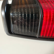 Load image into Gallery viewer, Hella Smoked Tail Light Set Jetta Mk2
