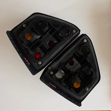 Load image into Gallery viewer, Hella Treser Smoked Tail Light Set Golf Mk2
