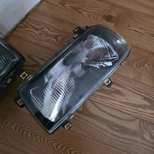 Load image into Gallery viewer, Smoked In.Pro E-Code Headlight Set Vento/Jetta Mk3
