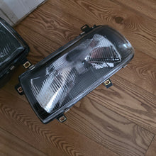Load image into Gallery viewer, Smoked In.Pro E-Code Headlight Set Vento/Jetta Mk3
