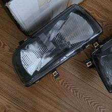 Load image into Gallery viewer, Smoked In.Pro E-Code Headlight Set Vento/Jetta Mk3
